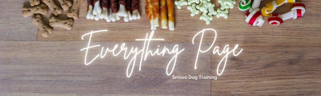 Assorted dog treats arranged in a row on a wooden surface with the text "Everything Page, Smiles Dog Training" overlaid in white script—perfect for showcasing everything your pup will love.